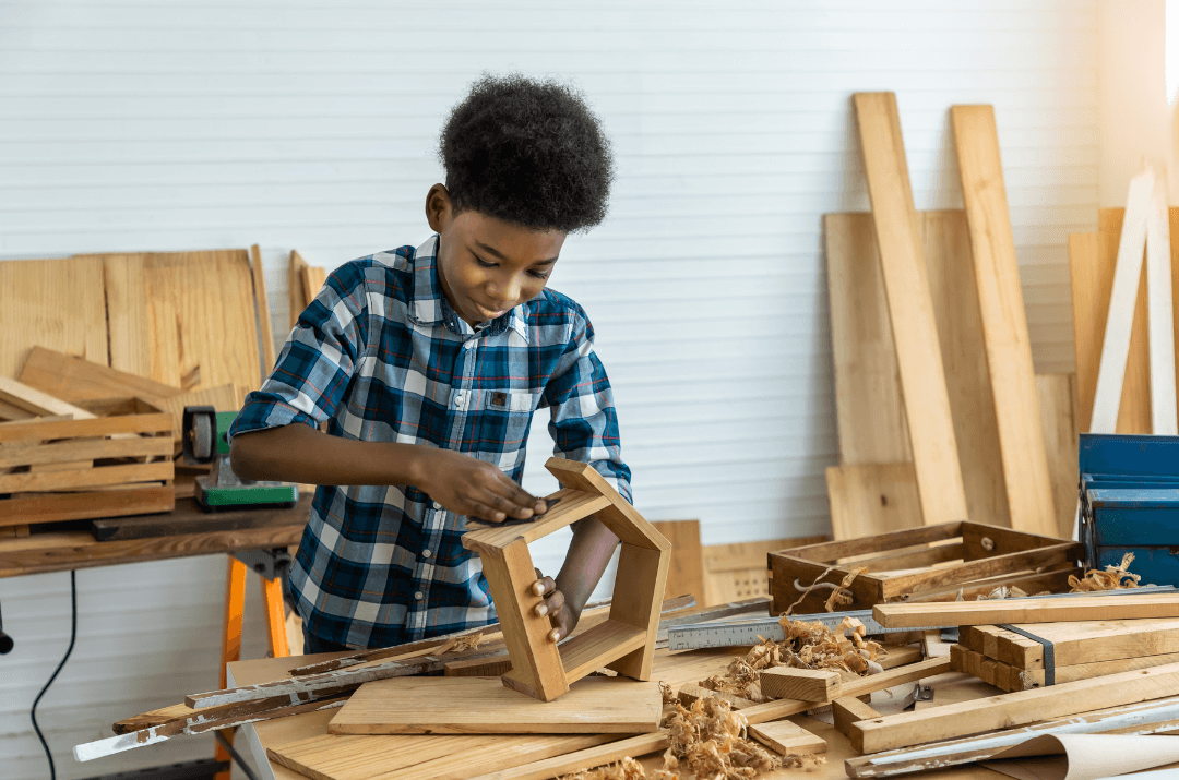 Boy in carpentry workshop